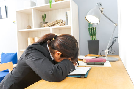 sleeping woman in suitの写真素材