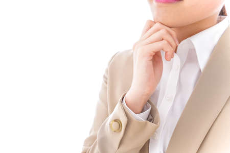 Business woman with a hand on her chin, closeup of photoの写真素材