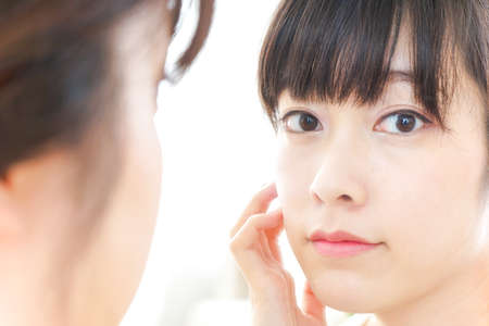 Young woman doing skin careの写真素材