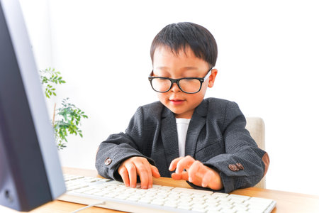 Child businessman working at officeの写真素材