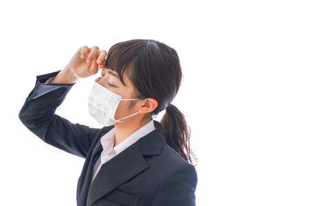 Businesswoman wearing a mask to prevent the spread of coronavirusの写真素材
