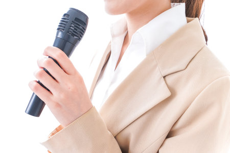 Woman talking with microphoneの写真素材