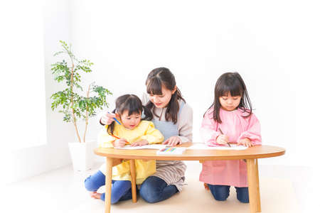 Child Studying at Home with Teacher and Preschooler Illustrationの写真素材