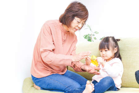 Child play with grandmotherの写真素材