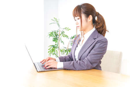 Business woman using a laptopの写真素材