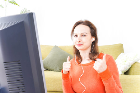 Online lesson teacher in front of computerの写真素材