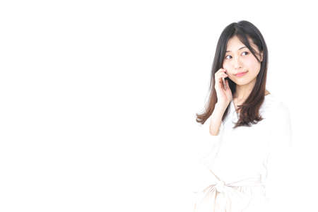 Young woman using smartphoneの写真素材