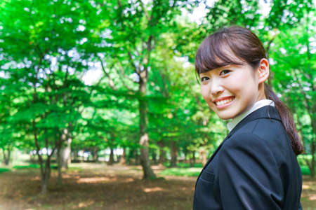 Young business woman smiling with suitの写真素材