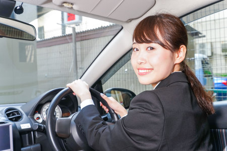 Young business woman in carの写真素材