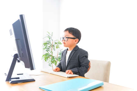 Child businessman working at officeの写真素材