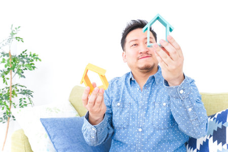Man comparing real estate