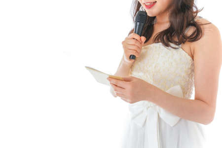 Young woman singing with microphone and tablet on white background, closeupの写真素材