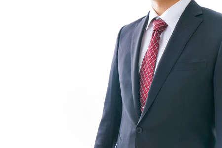 Businessman wearing suit and red tie on white background, closeupの写真素材
