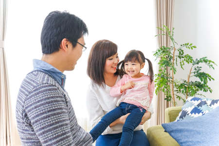 Family having fun at homeの写真素材