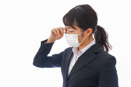 Business woman wearing a mask to avoid the spread of coronavirusの写真素材