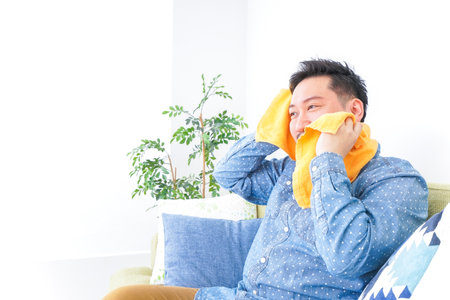 Relaxed man at homeの写真素材