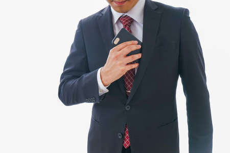 Businessman wearing a suit and tie, closeup of hands.の写真素材