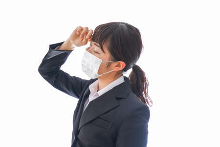 Business woman wearing a mask to prevent the spread of coronavirusの写真素材