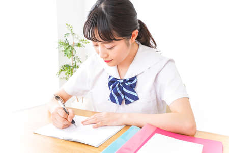 Student studying at the desk image taken in japanese high schoolの写真素材