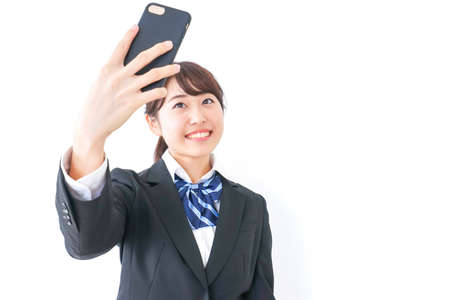 high-school girl making a video-phone callの写真素材
