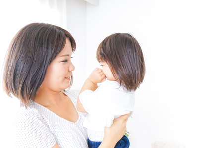 Mother hugging childの写真素材