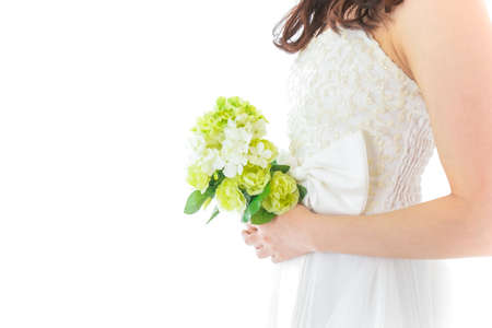 Bride holding a bouquet of flowers isolated on white background, closeupの写真素材