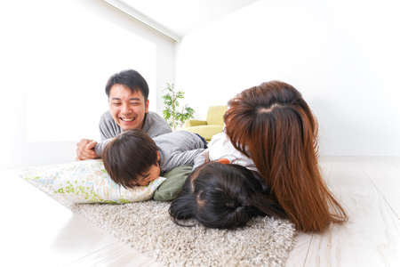 Happy family playing together at home, high-angle shot of a happy family.の写真素材