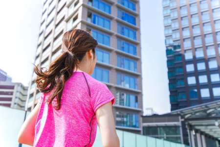 Woman running in the city
