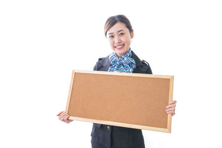 Cabin crew holding a boardの写真素材
