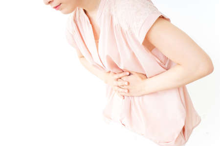 Young woman suffering from a stomachacheの写真素材
