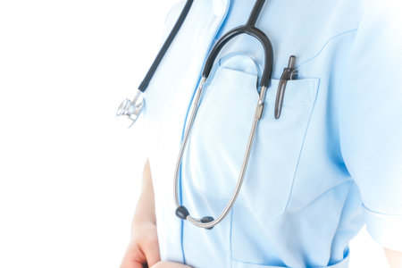 Doctor with stethoscope on white background, closeup. Space for text
