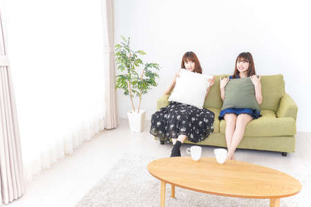 Yong woman party at homeの写真素材