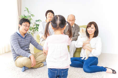 Playing child and friendly familyの写真素材