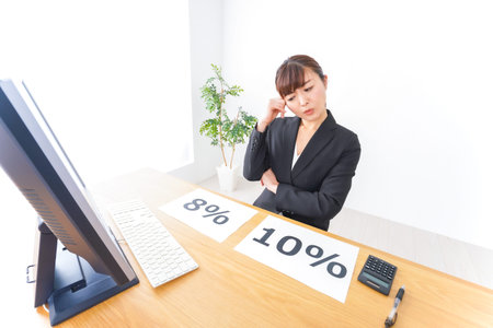 Businesswoman at the office showing percentage sign - closeup of photo
