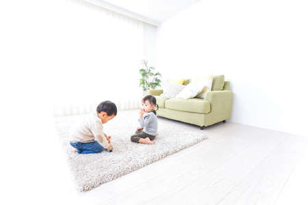 Brothers playing at homeの写真素材