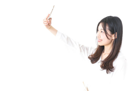Young woman taking Selfie photosの写真素材