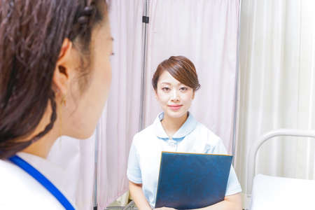 female doctor and nurse doing a meetingの写真素材