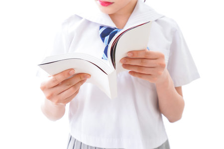 Close-up image of a girl holding a book isolated on white background