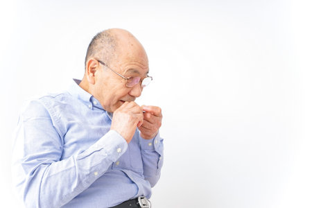 Aged man sitting on the chair