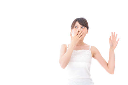 Young woman getting a surpriseの写真素材
