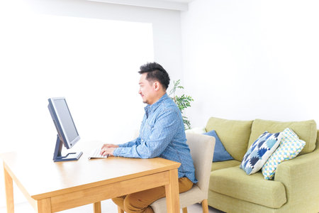 Man using laptop at home