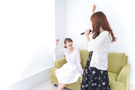 Young woman at Karaokeの写真素材