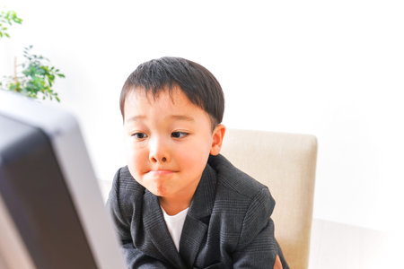 Child businessman at officeの写真素材