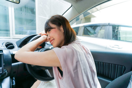 Young woman sleeping in car