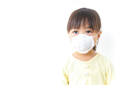 A child wearing a face maskの写真素材