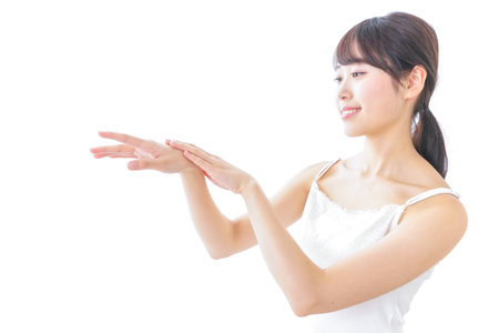 young woman applying a creamの写真素材