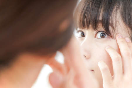 Young woman doing skin careの写真素材