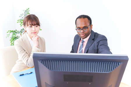 Businesspersons working in officeの写真素材
