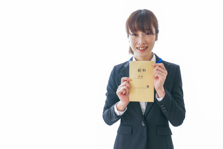 Businesswoman being delighted at payoffの写真素材