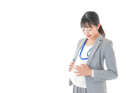 Pregnant woman in a suit and a stethoscope image